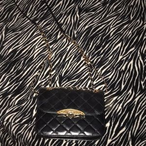 A nice leather black purse with gold detailing